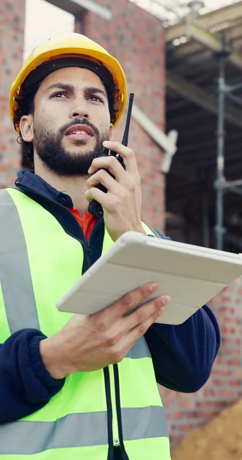 Tablet, man and radio on construction site with conversation for building, Stock Footage 336776783