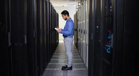 Tablet, man and technician in data center on research for programming at night Stock Photos