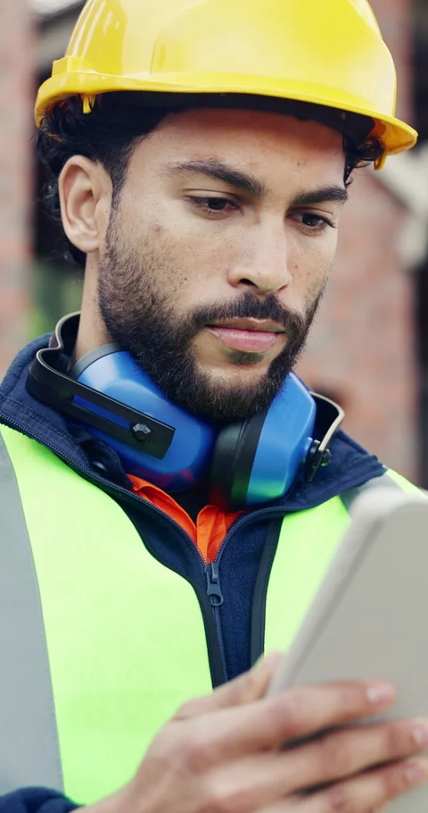 Tablet, man and thinking on construction site with planning for building, Stock Footage 336804325