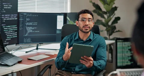 Tablet, man or programmer speaking with team for code review, debugging or AI Stock Footage 346946442