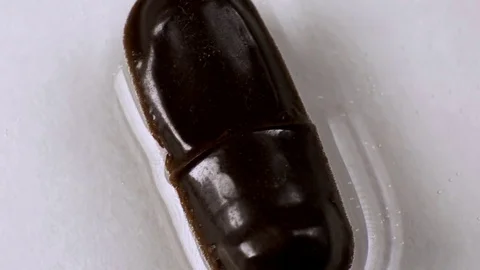 The tablet melts in the capsule in water Stock Footage 70640568