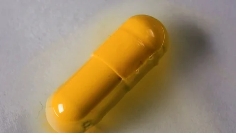 The tablet melts in the capsule in water Stock Footage 70640674