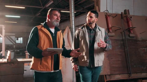 Tablet, men and walk in carpentry warehouse for progress auditing, digital Stock Footage 338045855