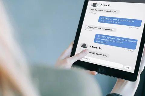 Tablet Messaging App Chat Screen in Female Hands Stock Photos