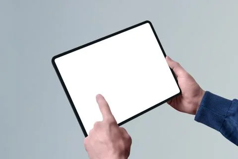 Tablet mockup in horizontal position in man hand. Left hand touch isolated sc Stock-Fotos