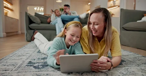 Tablet, mom and kid on floor for learning, reading ebook and relax with daughter Stock Footage 337924978