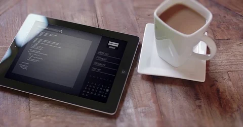 Tablet Move Right Coffee Mug on Table with Data Screen Stock Footage 83064291