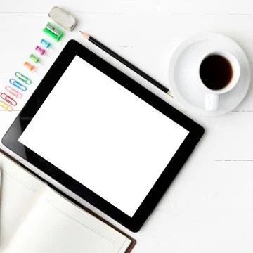 Tablet with notebook and coffee cup Stock Photos