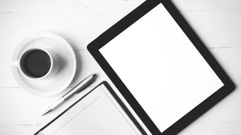 Tablet with notebook and coffee cup black and white color style Stock Photos
