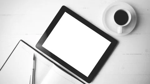 Tablet with notebook and coffee cup black and white color style Stock Photos