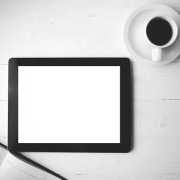Tablet with notebook and coffee cup black and white color style Stock Photos