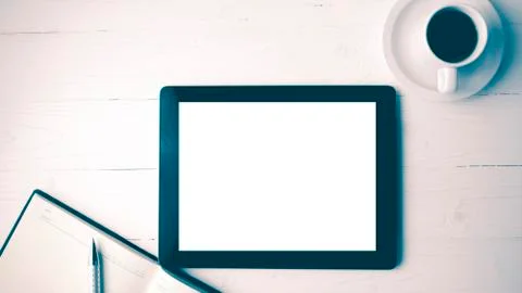 Tablet with notebook and coffee cup vintage style Stock Photos