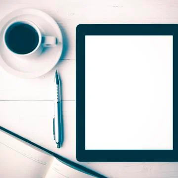 Tablet with notebook and coffee cup vintage style Stock Photos