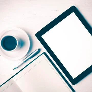 Tablet with notebook and coffee cup vintage style Stock Photos