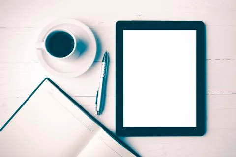 Tablet with notebook and coffee cup vintage style Stock Photos