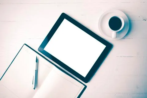 Tablet with notebook and coffee cup vintage style Stock Photos