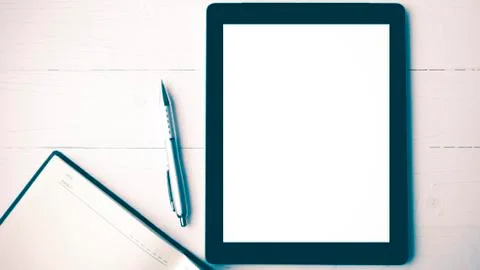 Tablet with notebook vintage style Stock Photos