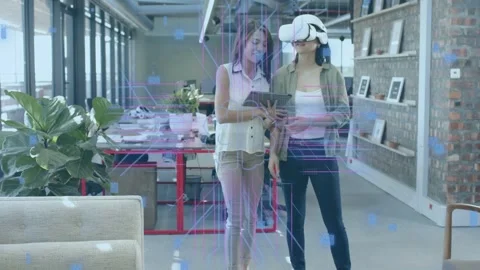 Tablet operator tapping tablet and guiding headset user through AR demo, 스톡 동영상 334743941