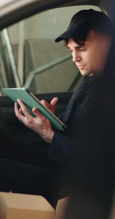Tablet, package and delivery man in vehicle for shipping, courier service and Stock Footage 342319533