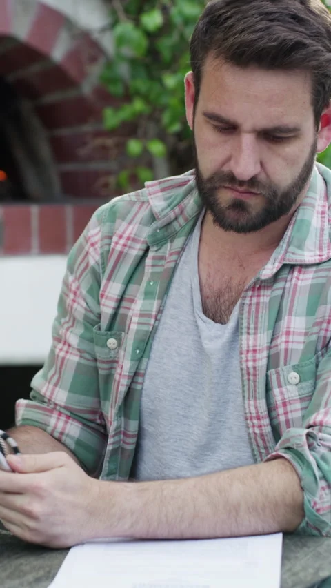 Tablet, paperwork and man typing in backyard, online tax application and bills Video stock 327193696
