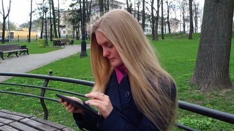 Tablet in the park Stock Footage 49494648