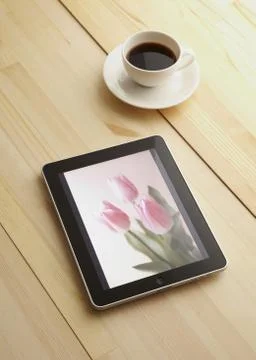 Tablet PC and hot coffee Stock Photos