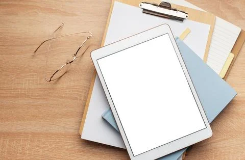 Tablet pc  and notebooks  on the office desk Stock Photos