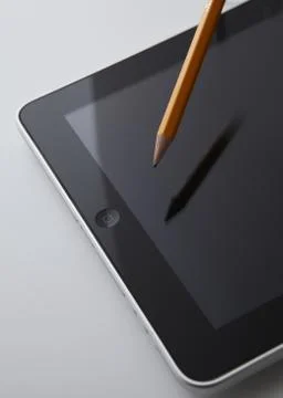 Tablet PC and pencil Stock Photos