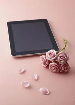 Tablet PC and roses Stock Photos