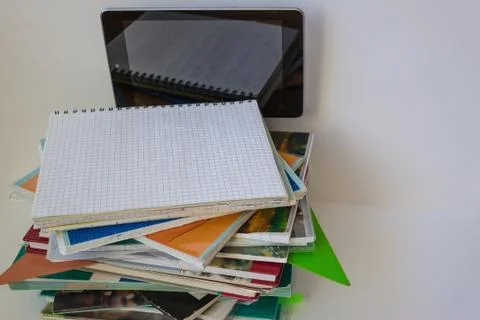 Tablet PC and school notebooks. Stock Photos