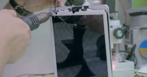 Tablet PC with broken touchscreen on repair service Stock Footage 53323992