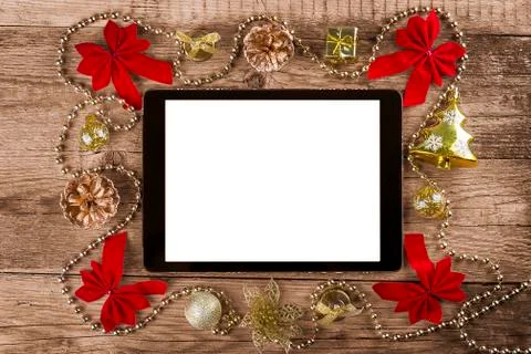 Tablet pc with christmas decorations Stock Photos