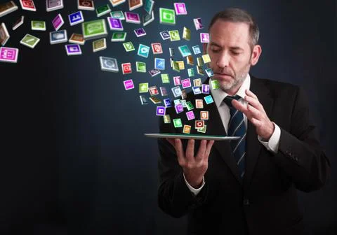 Tablet pc with cloud of application icons flying arround Illustrazione stock