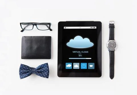 Tablet pc with cloud computing and personal stuff Stock Photos