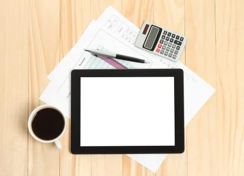 Tablet pc, cup of coffee and paper. Stock Photos