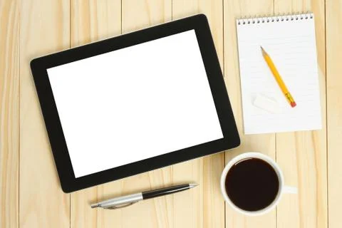 Tablet pc, cup of coffee with office supplies. Stock Photos