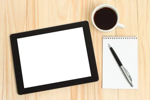Tablet pc, cup of coffee with office supplies. Stock Photos