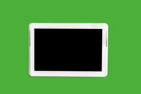 Tablet pc on a green background Stock Photos