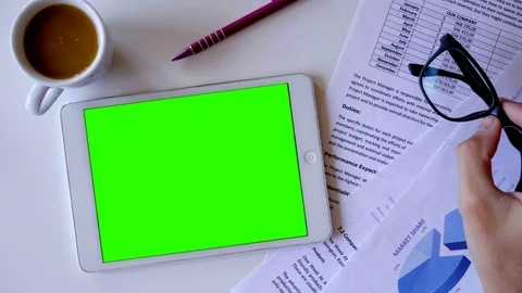 Tablet PC with Green Screen on whitte Table. 4K (UHD) Stock Footage 118431704