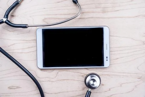 Tablet pc with medical objects on a desk Stock Photos