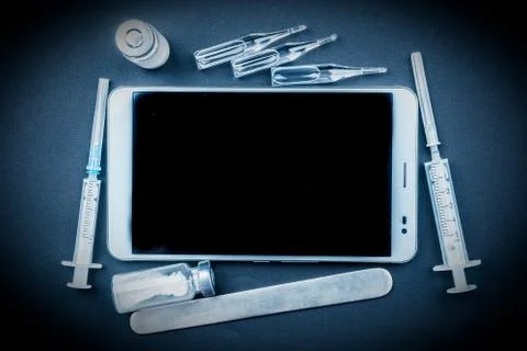 Tablet pc with medical objects on a desk Stock Photos