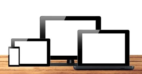 Tablet pc, mobile phone and computer on wooden table Fotos Stock