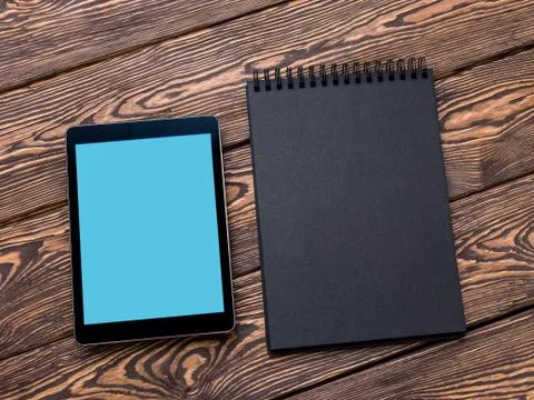 Tablet PC mock up over cafe table. Clipping path included. Stock Photos
