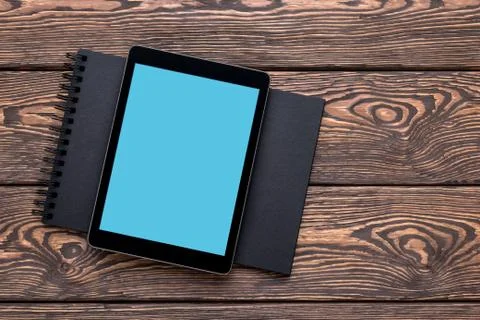 Tablet PC mock up over cafe table. Clipping path included. Fotos de archivo
