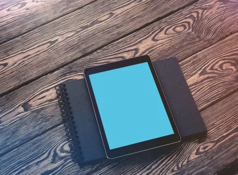 Tablet PC mock up over cafe table. Clipping path included. 写真素材