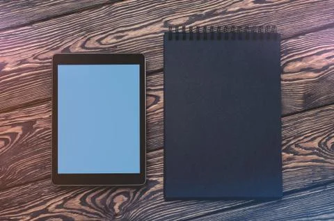 Tablet PC mock up over cafe table. Clipping path included. 写真素材