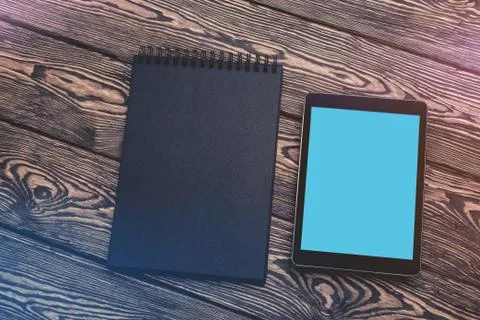 Tablet PC mock up over cafe table. Clipping path included. Stock Photos
