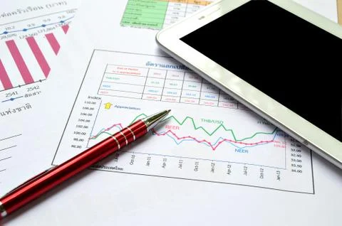 Tablet-pc, papers and pen on table Stock Photos