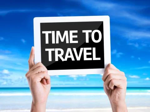Tablet pc with text Time To Travel with beach background Stock Photos
