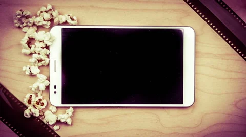 Tablet pc on wood with attributes of cinema Stock Footage 67822876